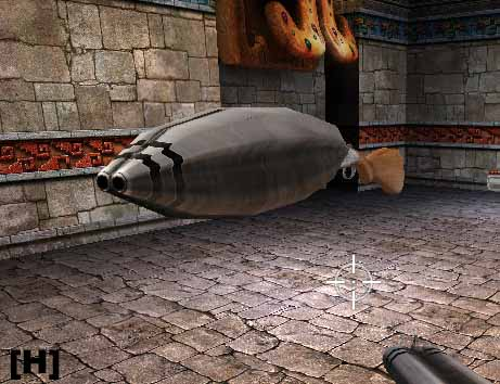 Ukázka nafouknuté zbraně ve hře Serious SAM Na obrázku nafouknutá brokovnice, vznášející se v prostoru, nabízející se hráči k vyzvednutí. okolo dlážděná podlaha a dlážděné zdi lemované aztéckým vodorovným pruhem. 